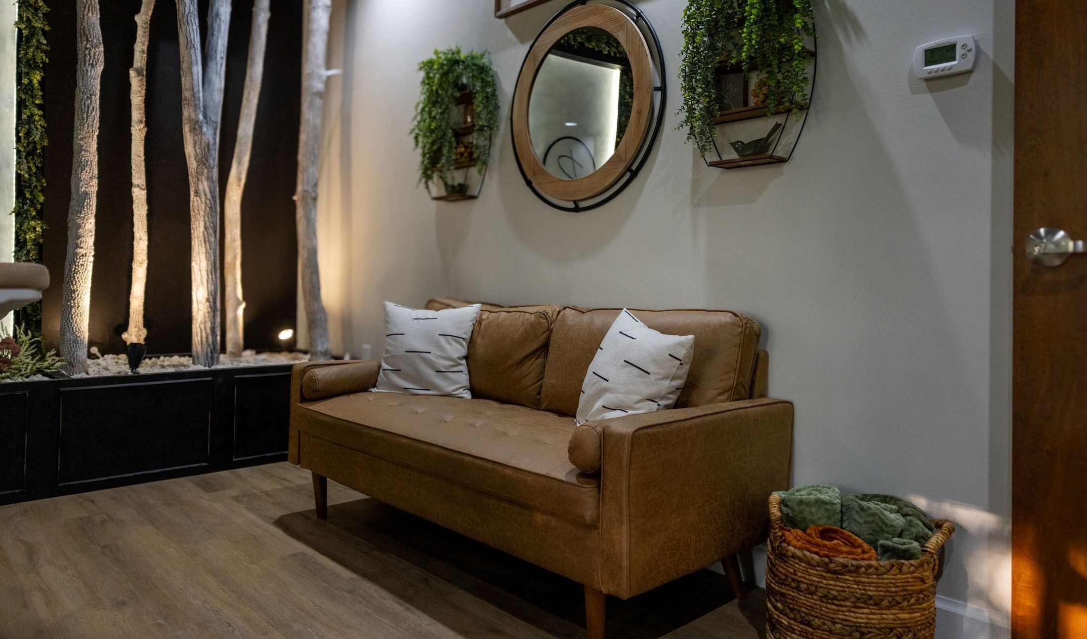 Cozy living room with a stylish brown sofa.